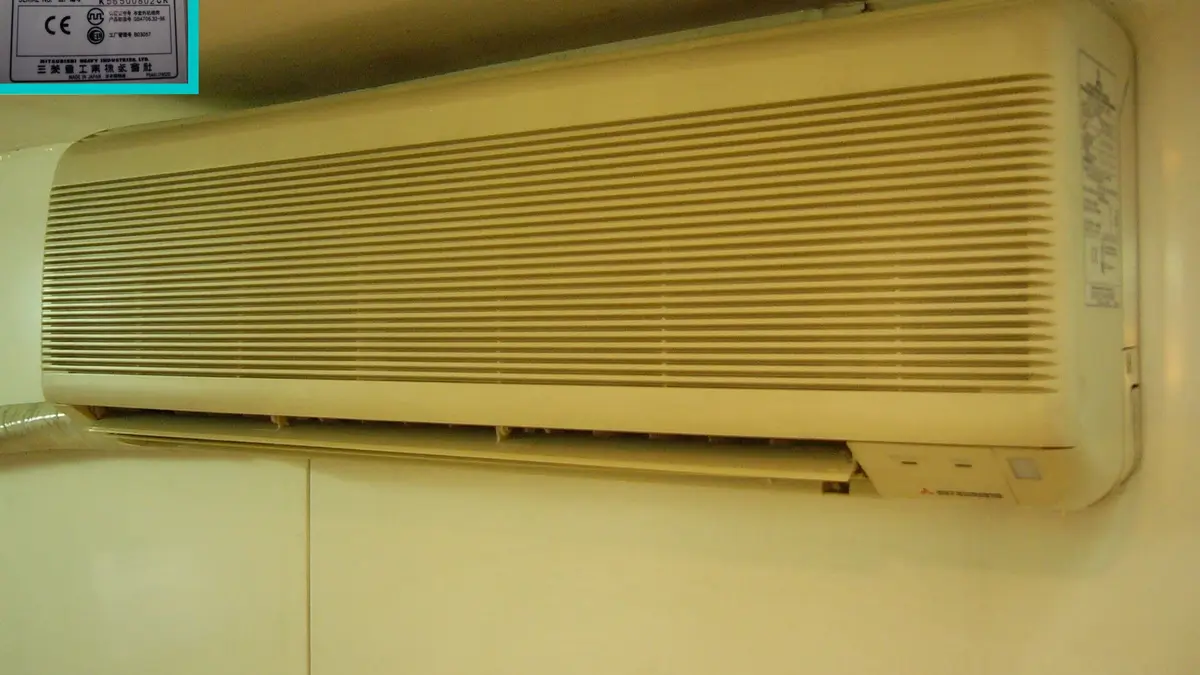 Indoor air conditioning unit mounted high on a wall