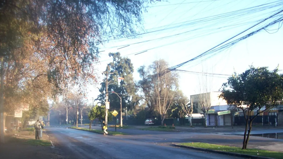 Street in Buin, Chile, with utility poles and overhead power lines