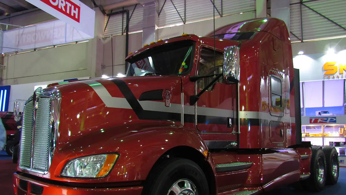 Red Kenworth T660 truck displayed at a transport fair in Chile