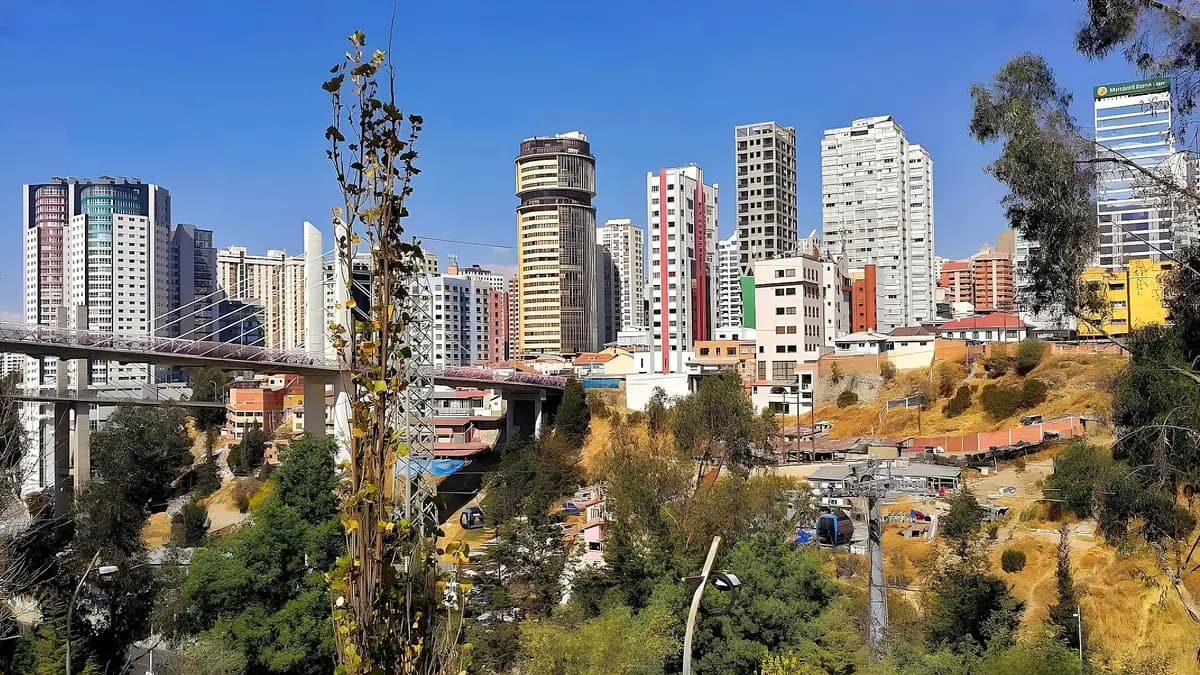 Buildings in central La Paz, Bolivia, with hills and a cable car in the background
