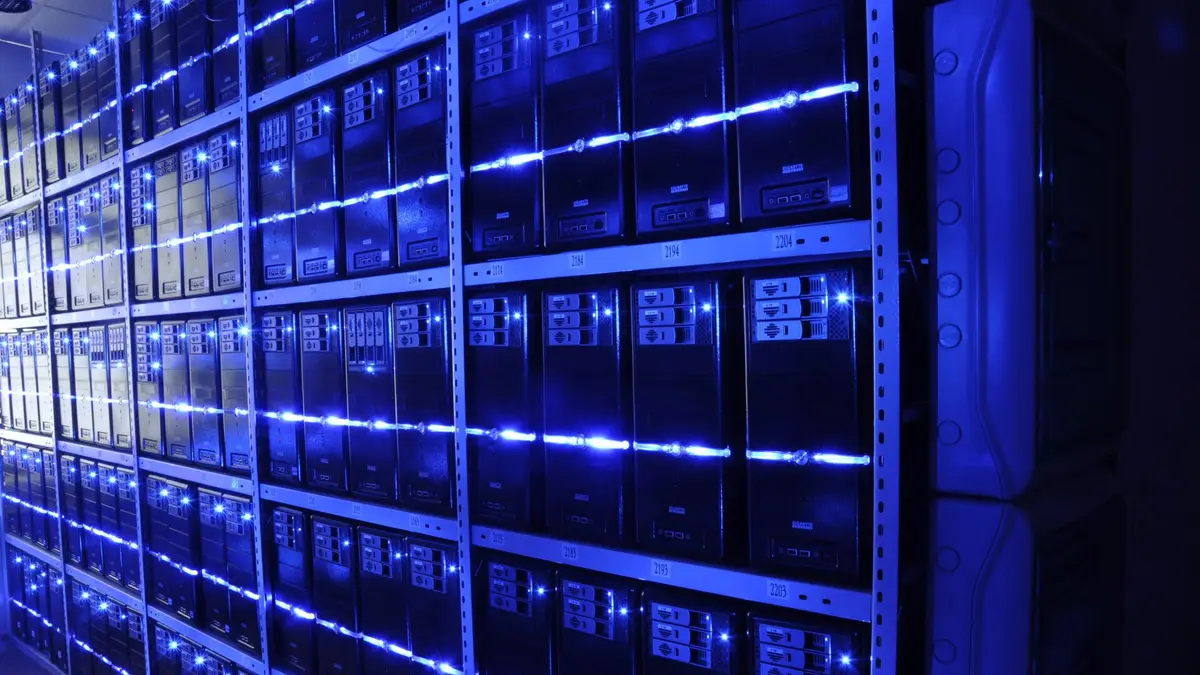 Rows of servers lit with blue lights in a data centre