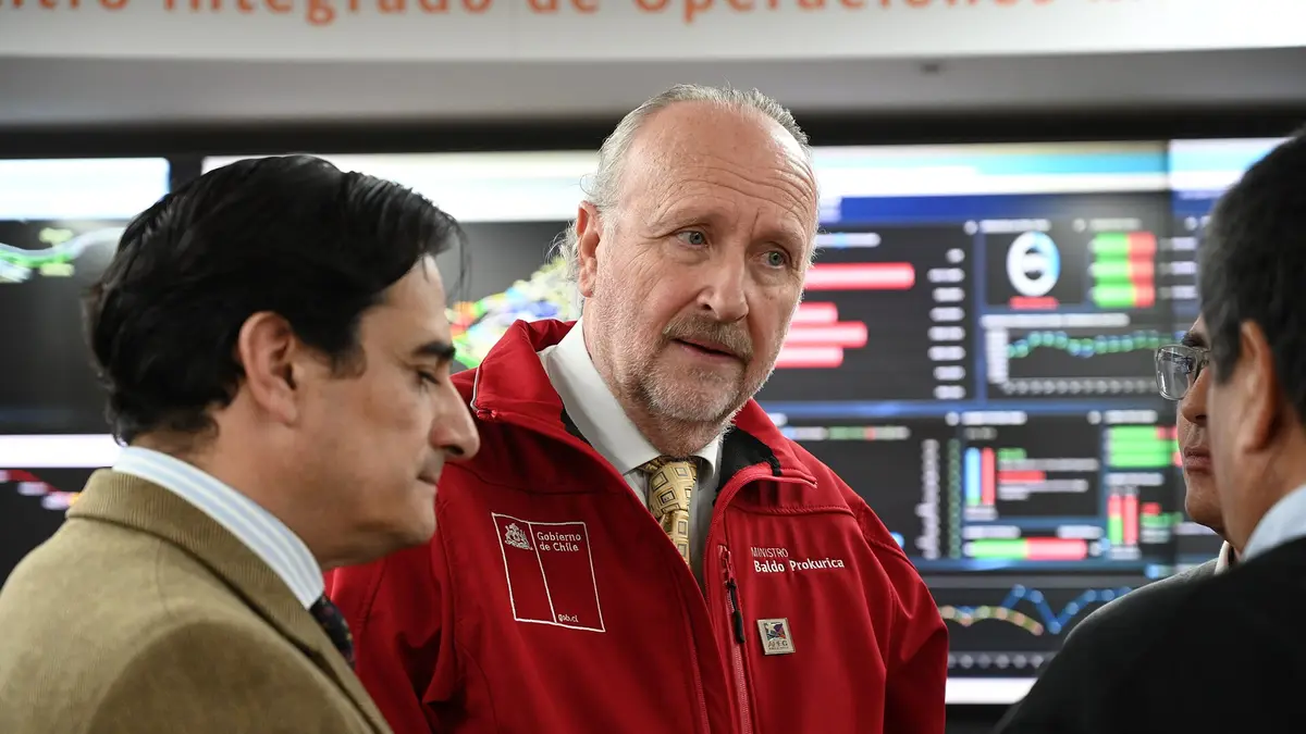 Officials at the El Teniente mine's integrated operations centre in front of monitoring screens