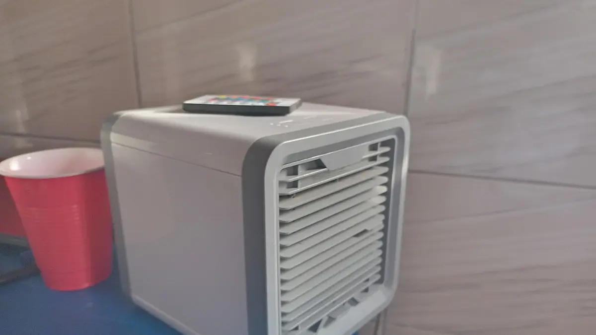 Small evaporative air cooler on a table