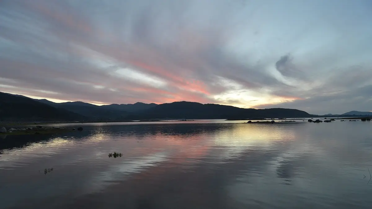 Sunset over Lake Colbún, the reservoir of the Colbún hydroelectric plant in Chile's Maule Region