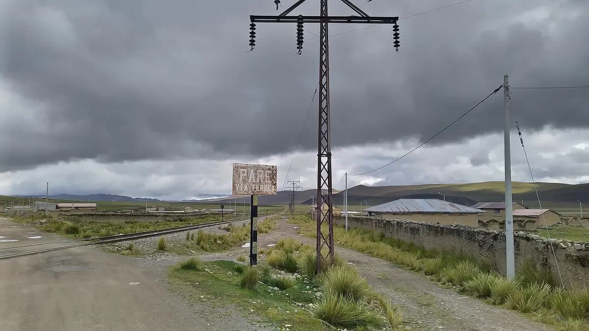 Tower of a power line on the high plateau of Junín, Peru, next to a railway