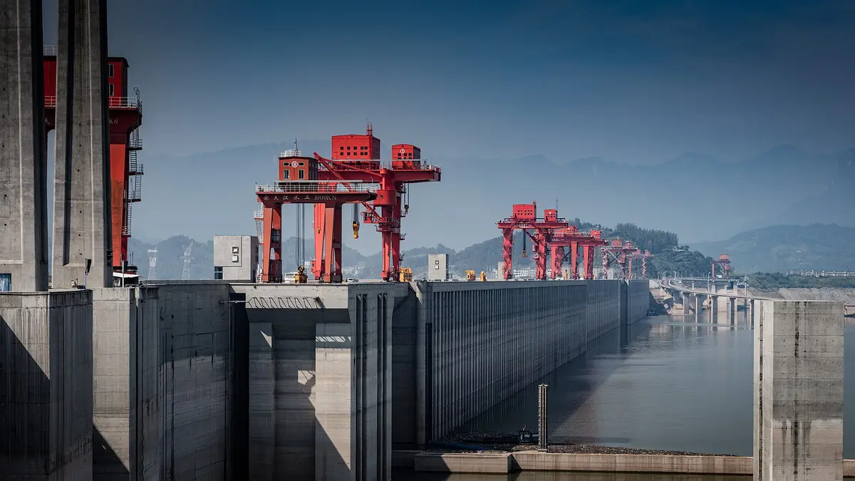 Wall of the Three Gorges dam with its red cranes on the Yangtze River